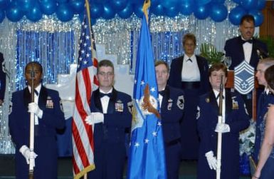 An Honor Guard comprised of U.S. Air Force CHIEF MASTER Sgts. Sandy Ware, Dave Sousa, Mike Gasque and Rebecca Pugsley, present the colors during the CHIEF Induction Dinner at the Tradewinds Enlisted Club, Hickam Air Force Base, Hawaii, on Jan. 21, 2005. (U.S. Air Force PHOTO by Angela Elbern, CIV.) (Released) at the Tradewinds Enlisted Club, Hickam Air Force Base, Hawaii, on Jan. 21, 2005. (U.S. Air Force PHOTO by Ms. Angela Elbern) (Released)