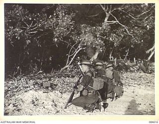 SIROT ISLAND, JOINING GREEN ISLAND, BOUGAINVILLE AREA, SOLOMON ISLANDS. 1944-12-20. D COY, 27 INFANTRY BATTALION TROOPS MANNING A MORTAR DURING AMPHIBIOUS TRAINING EXERCISES. THEY ARE FIRING ..