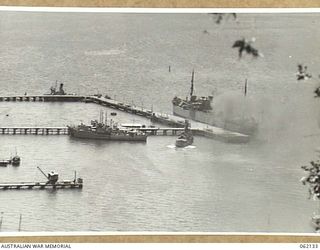 PORT MORESBY, NEW GUINEA. 1943-12-29. SHIPPING TIED UP AT THE PORT MORESBY PIERS