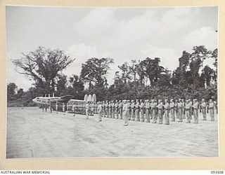 TOROKINA, BOUGAINVILLE. 1945-07-03. THE GUARD OF HONOUR COMPRISING ROYAL NEW ZEALAND AIR FORCE, US MARINE CORPS AND AUSTRALIAN TROOPS AT PIVA AIRSTRIP ON ARRIVAL OF HIS ROYAL HIGHNESS, THE DUKE OF ..