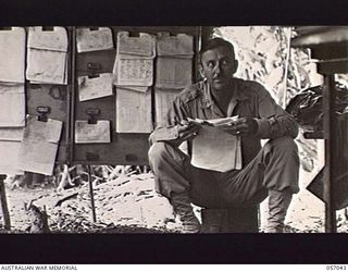 NADZAB AREA, NEW GUINEA. 1943-09-20. COLONEL R. E. CHANDLER, UNITED STATES ARMY, LIAISON OFFICER ATTACHED TO THE 7TH AUSTRALIAN DIVISION