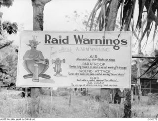 MILNE BAY, PAPUA. C. 1943-04. A SIGN SHOWING A LIST OF RAID WARNINGS, THE HANDIWORK OF SERGEANT DAVIES, A MEMBER OF NO. 6 (HUDSON) SQUADRON RAAF BASED ON TURNBULL STRIP