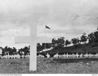 BOMANA WAR CEMETERY, NEW GUINEA. 1943-12-13. VIEW OF THE GRAVES IN THE WAR CEMETERY LOOKING FROM THE GRAVE OF 37572 LIEUTENANT COLONEL C. V. FERREY, BRITISH ARMY AND A MEMBER OF THE LETHBRIDGE ..