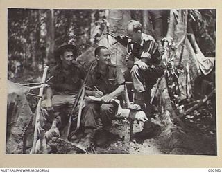 WONGINARA MISSION, NEW GUINEA. 1945-04-07. ORDERLY ROOM STAFF, 2/3 INFANTRY BATTALION. IDENTIFIED PERSONNEL ARE:- PRIVATE R.C. ERICHSEN (1); CORPORAL K.M. CAMPBELL (2); SERGEANT J.A. CARMAN (3)