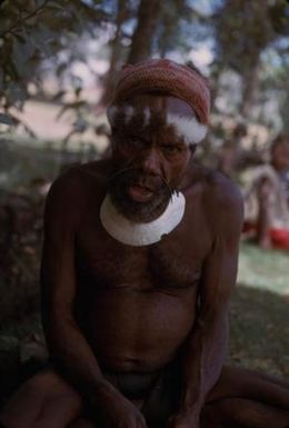 [Man sitting on grass in Eastern Highlands, Papua New Guinea]