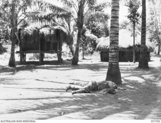 KAIAPIT, NEW GUINEA. 1943-09-22. THE BODY OF A DEAD JAPANESE SOLDIER IN KAIAPIT VILLAGE. OVER 200 JAPANESE WERE KILLED AND 50 WOUNDED BY MEMBERS OF THE 2/6TH AUSTRALIAN INDEPENDENT COMPANY IN THIS ..