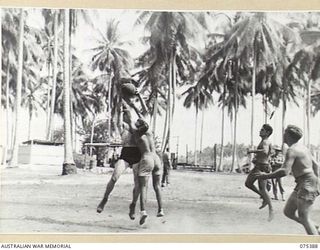 LAE, NEW GUINEA. 1944-08-19. AN EXCITING MOMENT DURING THE BASKETBALL MATCH BETWEEN TEAMS FROM THE HMAS "MANOORA" AND HEADQUARTERS, 5TH DIVISION DURING THE INTER UNIT SPORTS MEETING