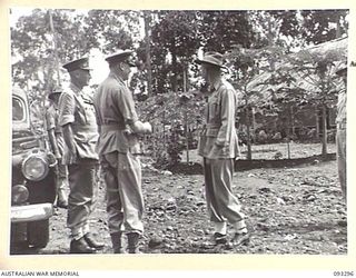 NADZAB AREA, NEW GUINEA, 1945-06-27. HIS ROYAL HIGHNESS, THE DUKE OF GLOUCESTER, GOVERNOR GENERAL OF AUSTRALIA (2) BEING RECEIVED BY LT-COL L.H. FERRAR, CHIEF INSTRUCTOR OF THE SCHOOL OF SIGNALS, ..
