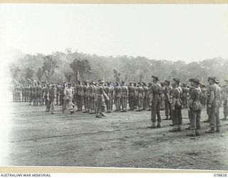 BOUGAINVILLE ISLAND. 1945-01-30. VX13 LIEUTENANT GENERAL S.G. SAVIGE, CB, CBE, DSO, MC, ED, GENERAL OFFICER COMMANDING, 2ND AUSTRALIAN CORPS INSPECTING TROOPS OF HEADQUARTERS, 15TH INFANTRY BRIGADE