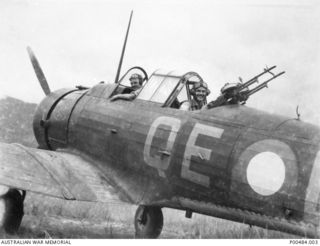 A Wirraway aircraft of No. 4 Squadron RAAF showing twin mounted Vickers gas operated guns made up in the Squadron. Identified are: 401866 Flying Officer John Maxwell Utber (Pilot); 431015 Flight ..