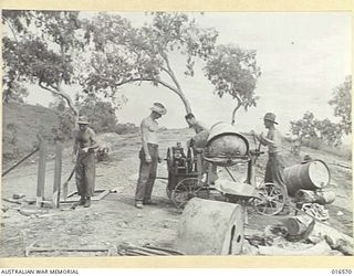 NEW GUINEA. 15 FEBRUARY 1944. AUSTRALIANS PREPARE FOUNDATIONS FOR A 90 FOOT TRANSMITTING AERIAL FOR THE RADIO STATION, 9PA, WHICH, UNDER THE DIRECTION OF THE AUSTRALIAN BROADCASTING COMMISSION ..