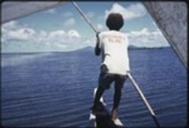 Manus: Pondrilei uses pole to guide canoe near Pere village