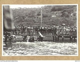 PORT MORESBY, NEW GUINEA. 1943-11-28. START OF THE WOMEN'S SPRINT FINAL AT THE ALLIED SERVICES GRAND SWIMMING CARNIVAL