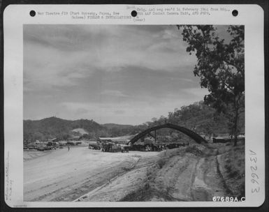 Panorama of the 27th Air Depot Group hangar and repair area at the Port Moresby Air Depot, Papua, New Guinea. 3 October 1943. (U.S. Air Force Number 67689AC)