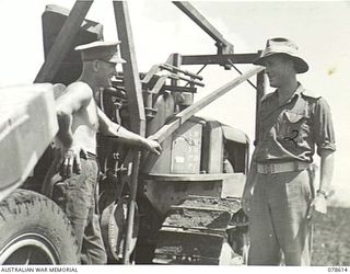 CAPE CUNNINGHAM, NEW BRITAIN. 1945-01-22. NX12192 MAJOR C. YOUNG, OFFICER- IN- CHARGE, 2/3RD RAILWAY CONSTRUCTION COMPANY (2) CHATTING WITH QX31200 SAPPER G. METCALF (1) DURING THE BUILDING OF THE ..