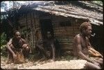 Men in front of house