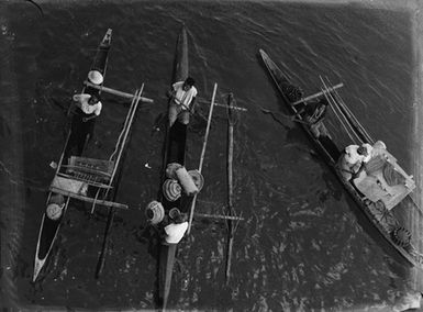 [Elevated view of three Pacific Island canoes]