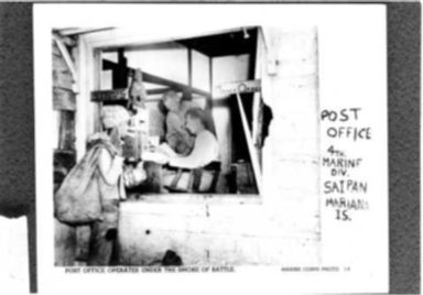 WORLD WAR II: POST OFFICE OPERATES UNDER THE SMOKE OF BATTLE - 4TH MARINE DIVISION