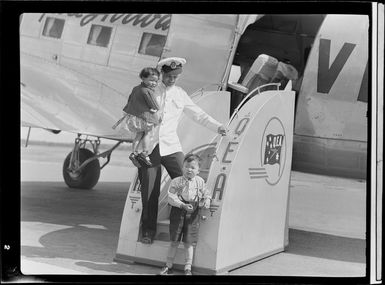 Qantas Empire Airways, Bird of Paradise Service flight steward C J Breen with the Ching children, Papua New Guinea