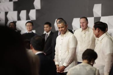 Barack Obama joins Asia Pacific Economic Cooperation Summit leaders and spouses for a group photo in Pasay, Metro Manila, Philippines, November 18, 2015