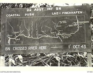FINSCHHAFEN AREA, NEW GUINEA. 1944-03-21. ONE OF MANY BATTLE SIGNS IN THE FINSCHHAFEN AREA, THIS SIGN RECORDS THE PASSING OF THE 22ND INFANTRY BATTALION IN THE COASTAL PUSH FROM LAE TO FINSCHHAFEN