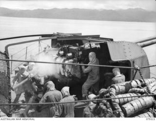 The crew of the 4” twin guns aboard the RAN vessel HMAS Swan laying sown a barrage on the Japanese positions in the But-Kuak area between Aitape and Wewak