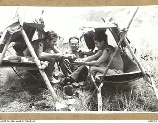 RAMU VALLEY, NEW GUINEA, 1943-10-20. NX85322 CORPORAL R.J. KELLETT (LEFT), NX111819 PRIVATE W.J. DOWNES (CENTRE) AND WX9088 CORPORAL E.R. LEONARD, ALL OF THE 2/7TH AUSTRALIAN INDEPENDENT COMPANY, ..