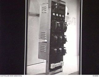 PORT MORESBY, NEW GUINEA. 1943-07-14. POWER PANEL FOR CHARGING BATTERIES USED TO OPERATE THE CARRIER SYSTEM OF THE NEW GUINEA LINES OF COMMUNICATION, SIGNALS, AIF