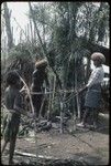 Food preparation: Pambo, Kiap (name) and Akis build above-ground oven