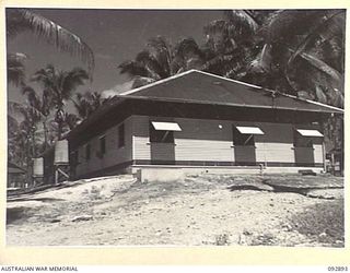 JACQUINOT BAY, NEW BRITAIN. 1945-06-09. THE PATHOLOGY, DENTAL AND DISPENSARY BLOCK AT 2/8 GENERAL HOSPITAL, IN HEADQUARTERS 5 BASE SUB-AREA. IT IS BUILT OF LOCALLY CUT AND SAWN TIMBER WITH ROOF AND ..