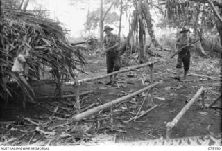 HANSA BAY-BOGIA HARBOUR AREA, NEW GUINEA. 1944-08-01. N180412 PRIVATE J.J. MCDERMOTT (1) AND NX190354 PRIVATE B.P. MCGLINN (2) A TWO MAN PATROL FROM AN OUTPOST MANNED BY NO.3 SECTION, NO.13 ..