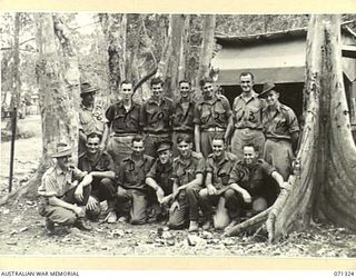 SCARLET BEACH, NEW GUINEA, 1944-03-19. STUDENTS AND INSTRUCTORS ATTENDING THE SCHOOL ON FIELD COOKING AND CATERING CONDUCTED BY THE 22ND INFANTRY BATTALION, 5TH DIVISION. SHOWN ARE: VX137071 ..