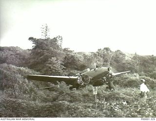 NEW BRITAIN, 1945-09. REMAINS OF NAKAJIMA J1N1 GEKKO "IRVING" NIGHT FIGHTER AIRCRAFT IN THE RABAUL/GAZELLE PENINSULA AREA. (RNZAF OFFICIAL PHOTOGRAPH.)