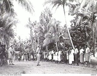 LAVONGAI BAY, NEW HANOVER, 1945-10-23. AN AUSTRALIAN NEW GUINEA ADMINISTRATIVE UNIT (ANGAU) ADMINISTRATIVE HQ WAS SET UP AT KAVIENG, NEW IRELAND, WITH CAPTAIN F. N. W. SHAND, ANGAU DISTRICT ..