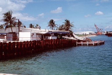 Trader Andy's Hut, a pierside bar and grill, displays damage sustained during an earthquake that struck the region on August 8th