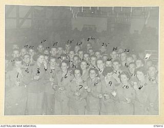 LAE, NEW GUINEA. 1944-10-03. GUESTS ENJOYING DRINKS AND SANDWICHES AT A DANCE TENDERED TO MEMBERS OF THE AUSTRALIAN ARMY MEDICAL WOMEN'S SERVICE BY THE OTHER RANKS OF THE 22ND AUSTRALIAN WORKS ..