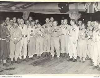 MADANG, NEW GUINEA. 1944-09-16. OFFICERS OF THE AUSTRALIAN ARMED SERVICES ATTENDING A COCKTAIL PARTY HELD AT THE CONCLUSION OF THE BOXING AND WRESTLING TOURNAMENT HELD AT THE 165TH GENERAL ..