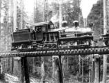 Broadside of Hammond two truck Shay locomotive #424 on trestle, Hammond Lumber Company, Oregon, between 1912 and 1934