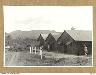 17 MILE, PORT MORESBY AREA, NEW GUINEA. 1943-12-13. TRIPLE "WILLIAMS" SHED USED FOR THE STORAGE FOR ARTILLERY SPARE PARTS AT NO. 3 SUB DEPOT, 10TH AUSTRALIAN ADVANCED ORDNANCE DEPOT