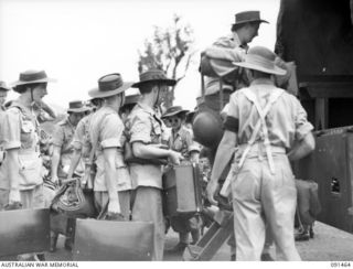 LAE, NEW GUINEA, 1945-05-07. AUSTRALIAN WOMEN'S ARMY SERVICE PERSONNEL EMBUSSING AT MILFORD HAVEN AFTER DISEMBARKATION FROM THE MV DUNTROON. THEY ARE PART OF A GROUP OF 342 AUSTRALIAN WOMEN'S ARMY ..