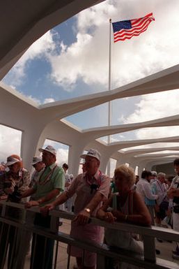 USS ARIZONA survivors look into the green waters that entomb their shipmates who died during the Dec. 7, 1941, bombing raid that sank the battleship. The survivors and their families are special guests of the USS ARIZONA Memorial for Remembrance Day ceremonies commemorating the 50th anniversary of the attack