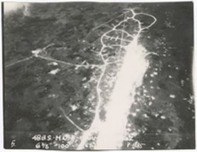 [Aerial view of unidentified location in Guam after aerial bombing]