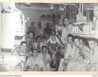 LAE, NEW GUINEA. 1944-08-18. THE SISTER-IN-CHARGE AND SOME OF THE PATIENTS IN ONE OF THE WARDS ABOARD THE 2/1ST HOSPITAL SHIP "MANUNDA"