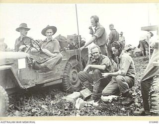 11 January 1944. NEW GUINEA. WHILE WAITING FOR THE BRIDGE TO BE COMPLETED OVER THE CREEK OF BLUCHER POINT, THIS MOBILE OBSERVATION RELAY WIRELESS STATION WAS STILL ON THE JOB DIRECTING FIRE FOR THE ..