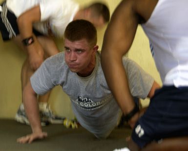 U.S. Air Force 2nd LT. Jonathen Searles, of 36th Commucations Squadron, pushes out a few more push-ups before his time is up during the Fit to Fight portion of the Team Andersen Challenge at Andersen Air Force Base, Guam, on Feb. 25, 2005. (U.S. Air Force PHOTO by AIRMAN Teresa M. Pumphrey) (Released)