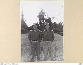 TOROKINA, BOUGAINVILLE, 1945-11-28. LIEUTENANT F.E. MCKELLAR (1) AND LIEUTENANT J.E. MARKS (2) OFFICERS OF 226 SUPPLY DEPOT PLATOON