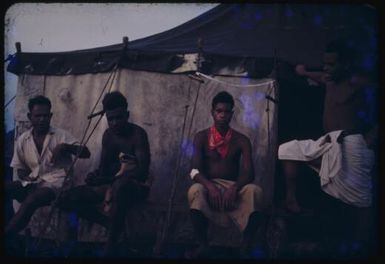 Portrait of Gevo Kila the senior hospital orderly, the driver Kaindi and two orderlies, Popondetta, Papua New Guinea, 1951 / Albert Speer