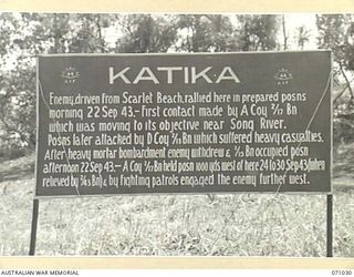 KATIKA, FINSCHHAFEN AREA, NEW GUINEA. 1944-03-13. ONE OF MANY BATTLE SIGNS IN THE FINSCHHAFEN AREA, THIS SIGN RECORDS ACTIVITIES OF THE 2/13TH, 2/15TH, 2/17TH AND 2/43RD INFANTRY BATTALIONS