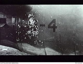 WARDS STRIP, PORT MORESBY, PAPUA, 1942-11-18. DAMAGE SUSTAINED BY NO 30 SQUADRON RAAF BEAUFIGHTER A19-4 (LY-D) DURING AN ATTACK ON LAE. THE AIRCRAFT WAS FLOWN ON THIS RAID BY WING COMMANDER B.R. ..