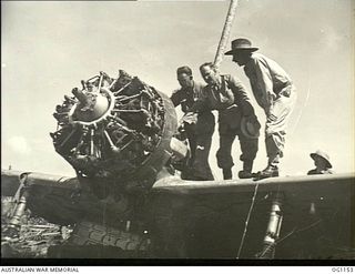 HOLLANDIA, DUTCH NEW GUINEA. C. 1944-06. THE MINISTER FOR WAR ORGANISATION OF INDUSTRY, JOHN DEDMAN, AND THE MINISTER FOR AIR, ARTHUR DRAKEFORD, INSPECTING THE ENGINE OF A CAPTURED JAPANESE "OSCAR" ..